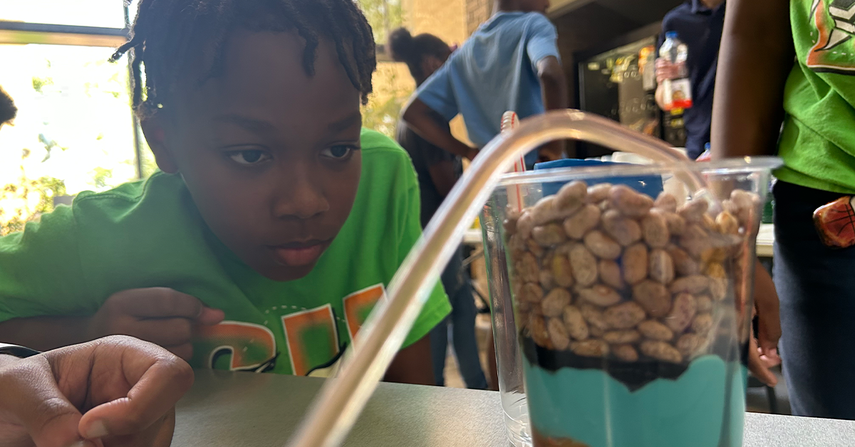 Student at CO2 camp at Southern University intently working on experiment