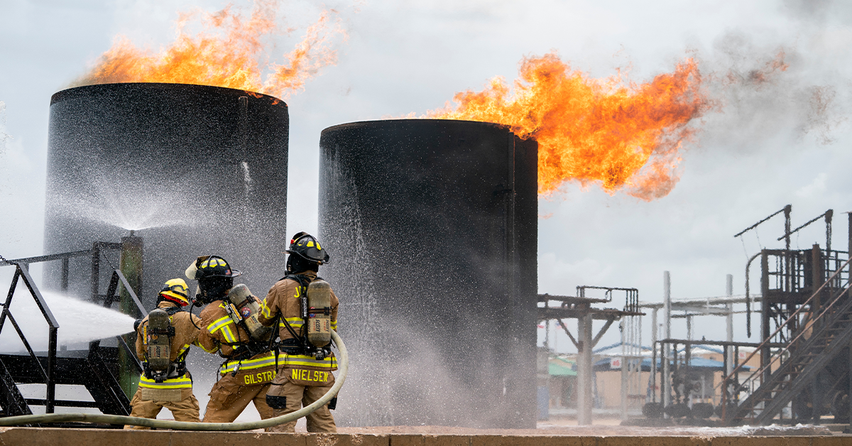 First responders participating in a simulated tank fire
