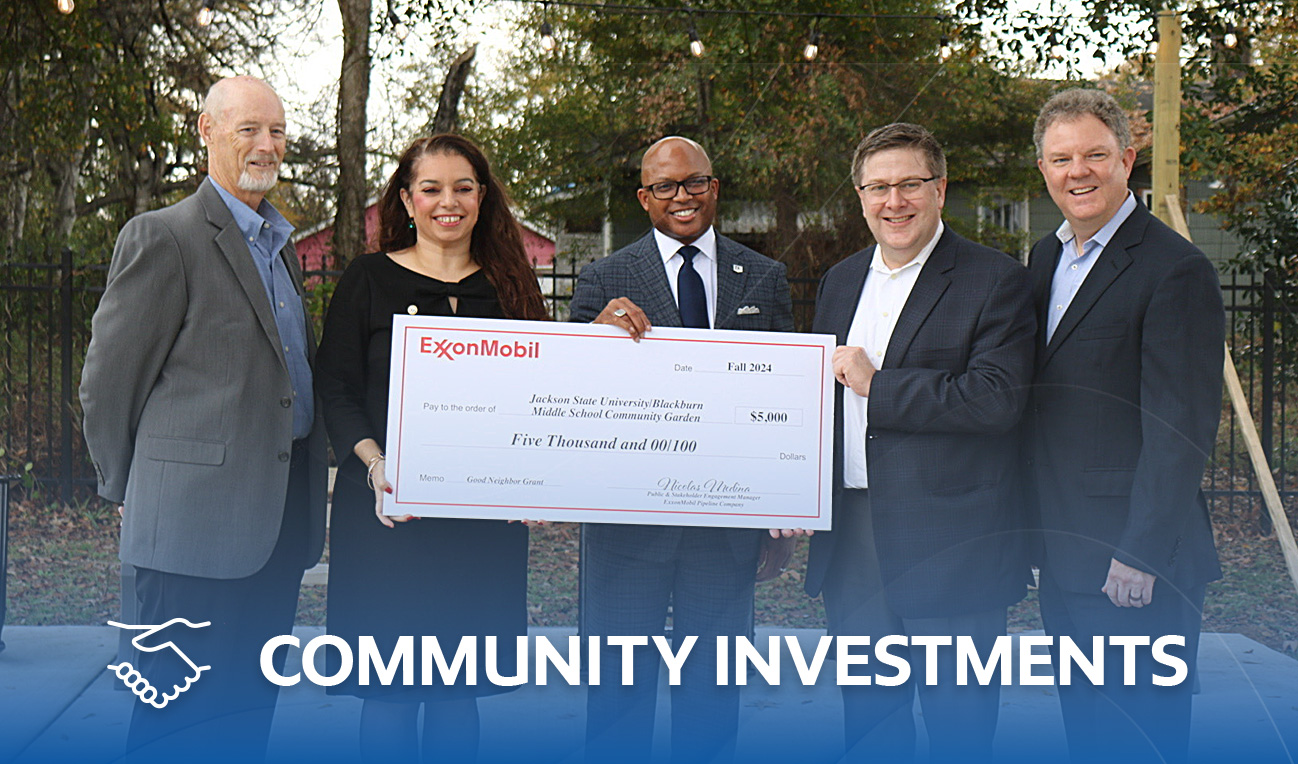 ExxonMobil representatives presenting community investment check